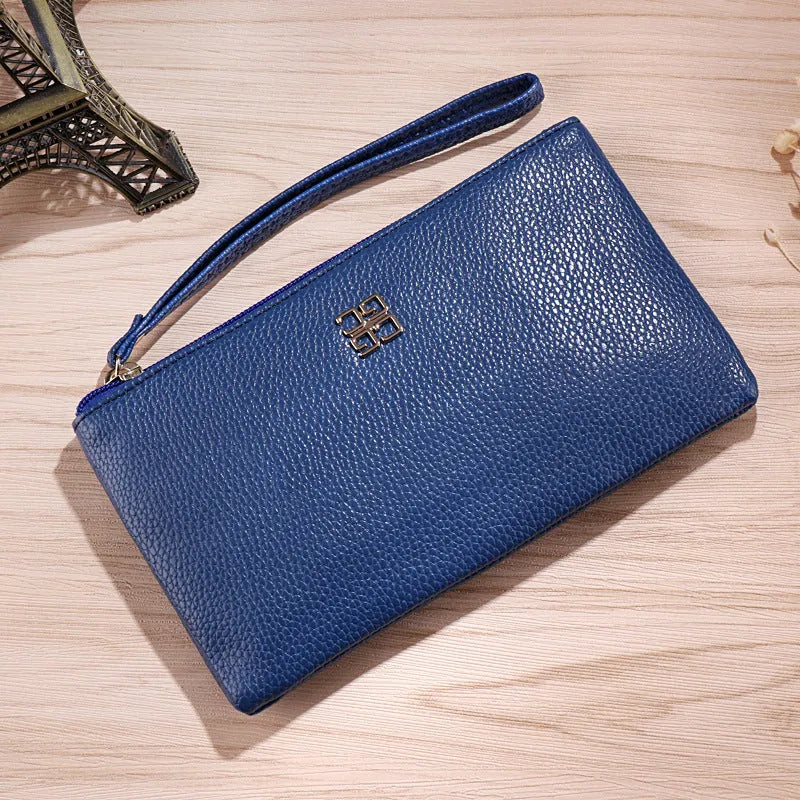 55-inch long PU leather phone wallet handbag with zipper closure in solid colour with visible stitching details