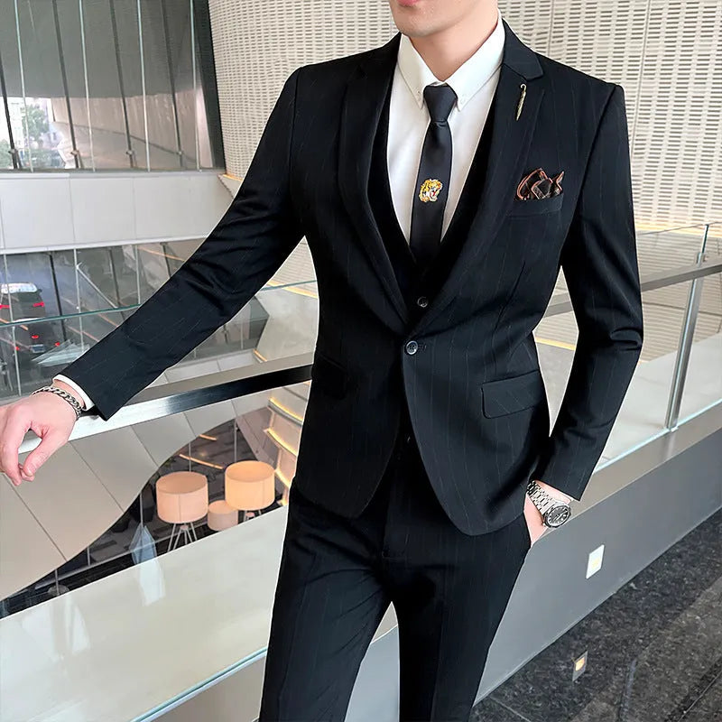 Men's three-piece striped suit set in black, slim fit, with jacket, vest and trousers on a hanger