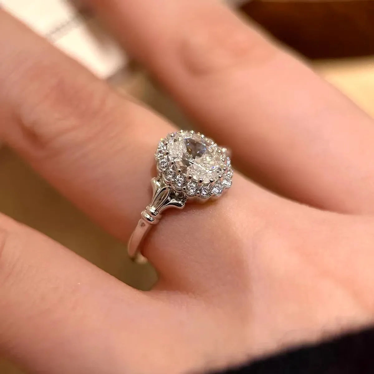 Silver women's ring with large geometric diamond centrepiece and adjustable opening.
