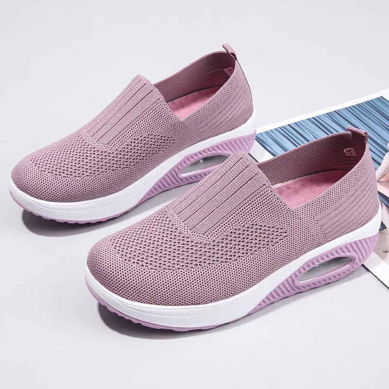 Women's casual running shoes with mesh and PU upper in beige, showing round toe and mid-heel design.