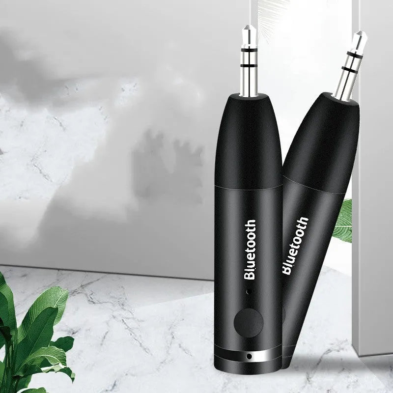 Black Bluetooth audio receiver for car stereo AUX input with USB cable