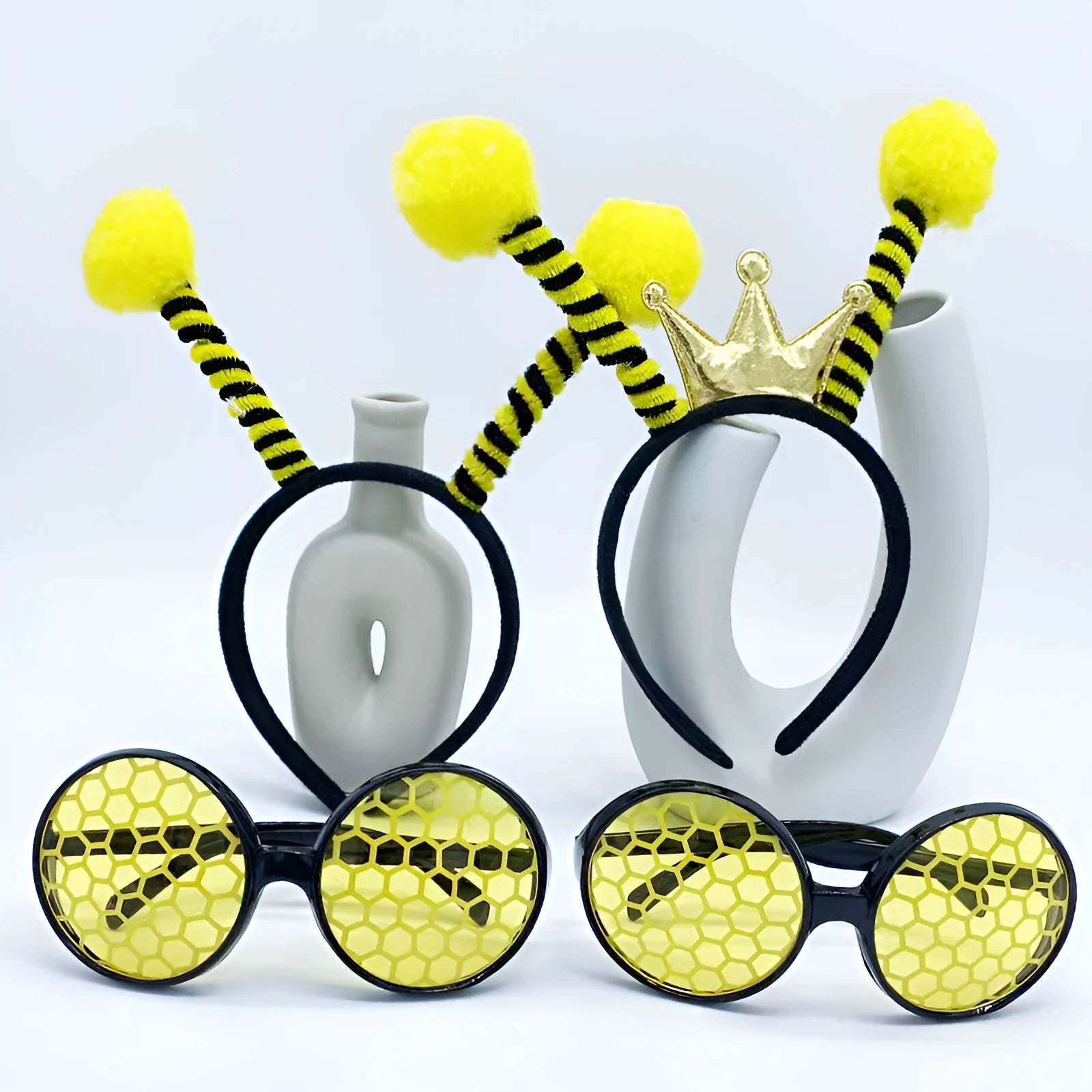 Yellow bees party dress up headband and prop glasses costume set on a mannequin head.