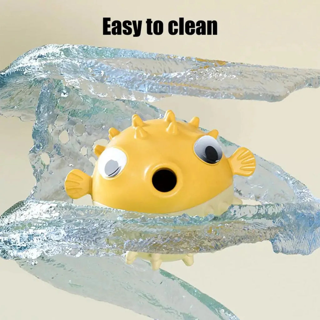 Yellow vinyl fish-shaped dog chew toy with textured surface and squeaker.