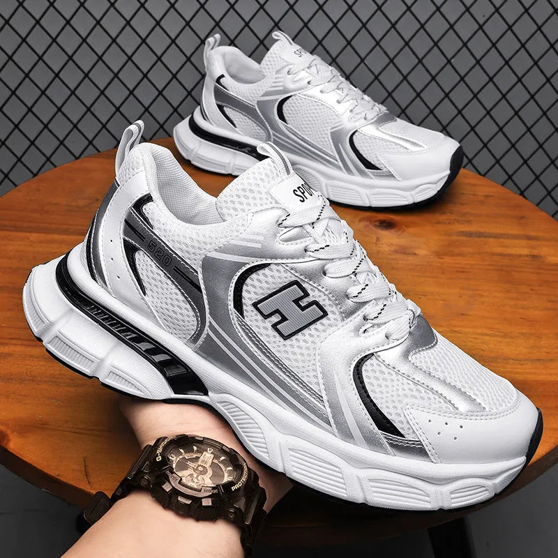 Men's mesh running shoes in black, white orange, and white and grey colours with plastic soles
