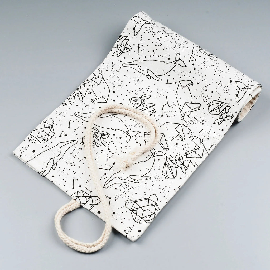 Canvas pencil case roll with starry sky pattern showing organised colour pencil slots