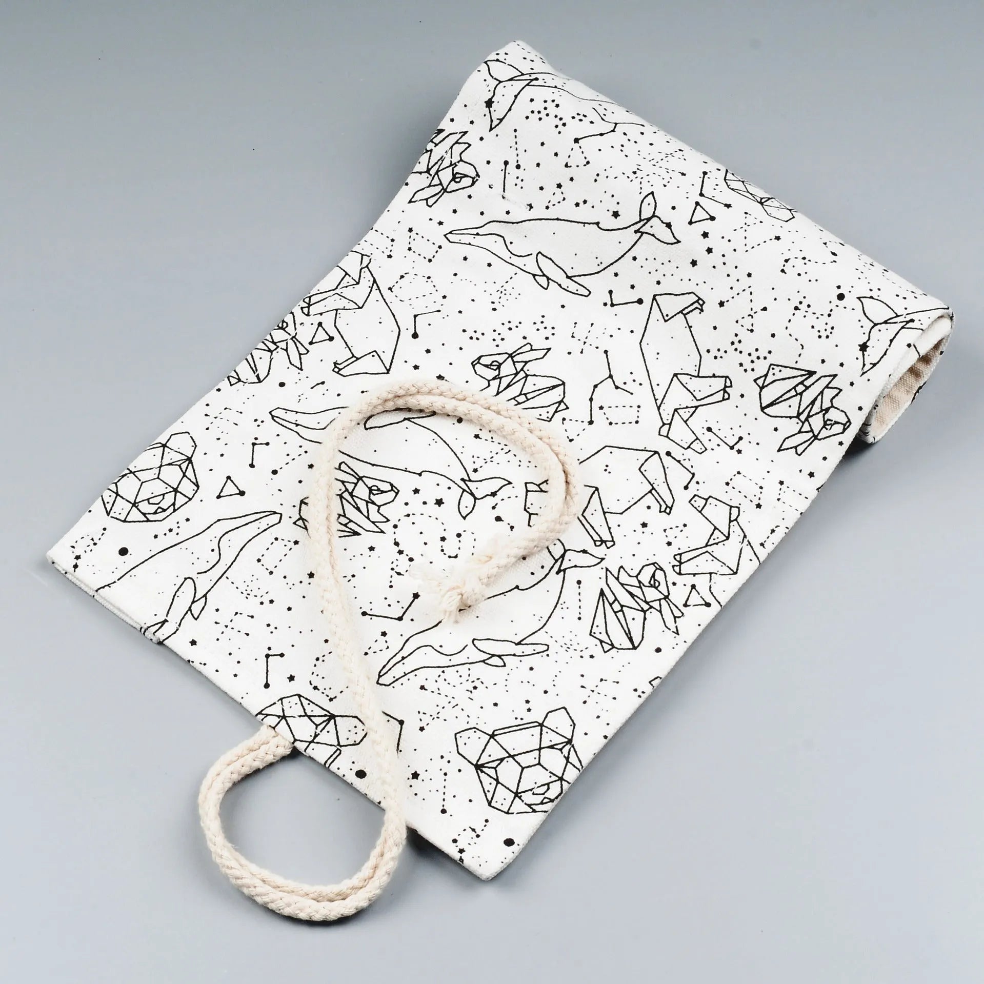 Canvas pencil case roll with starry sky pattern showing organised colour pencil slots