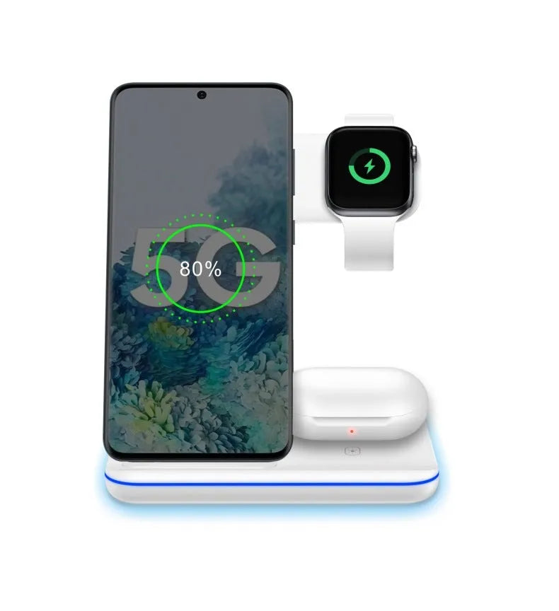 White three-in-one wireless charging stand for mobile phone, smartwatch, and headset on a desk.
