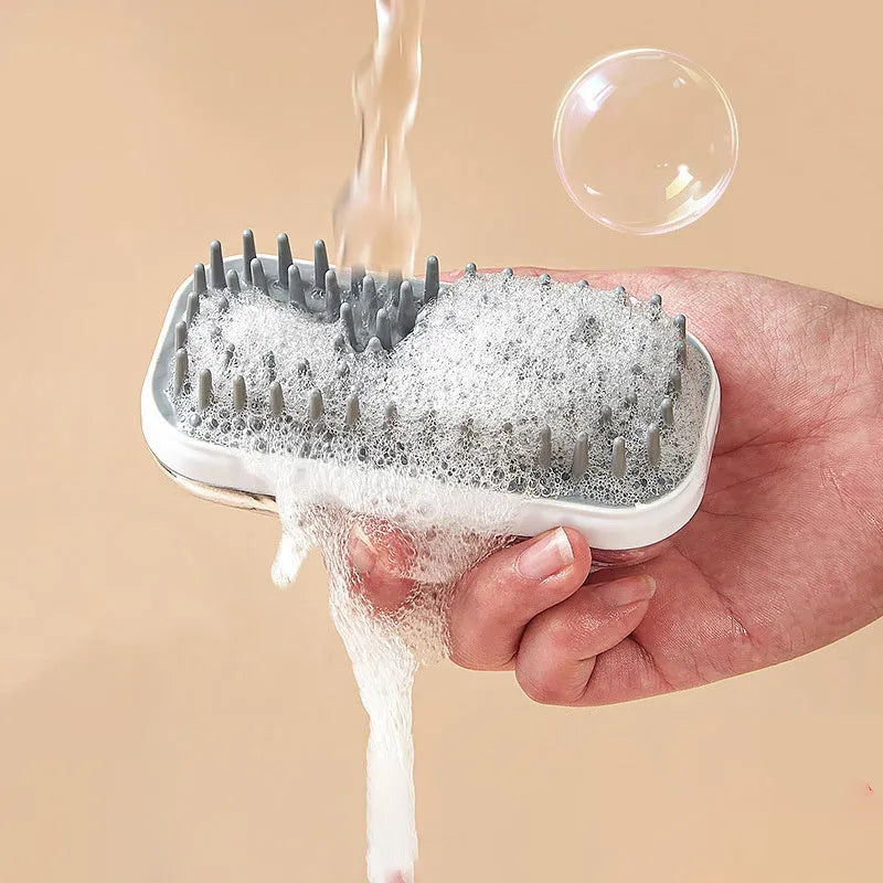 Grey silicone bath brush for pets with soft-tipped bristles and ergonomic handle