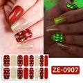 Christmas luminous nail stickers with glow effect and assorted patterns including strawberry, flower, and starry sky on nails