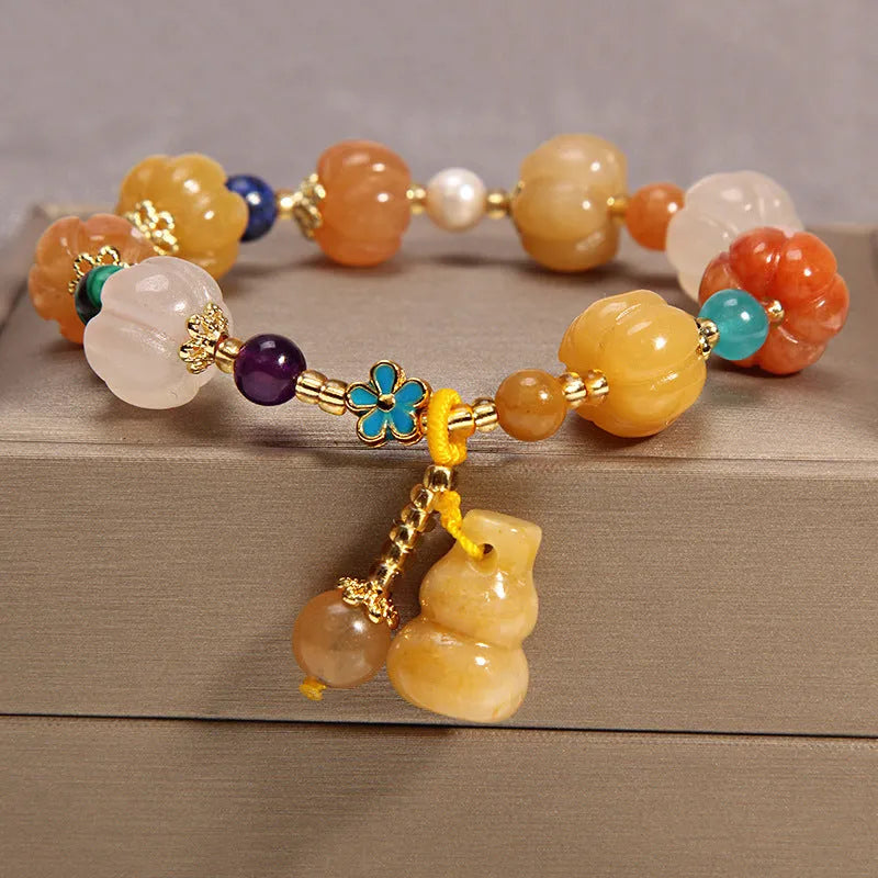 Khaki coloured crystal bracelet for women with an adjustable gold silk cord fastening.
