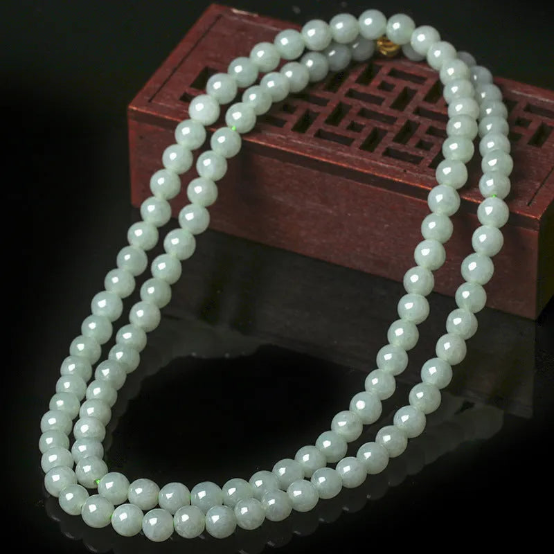 Natural jade bead necklace with white and green round beads on adjustable chain