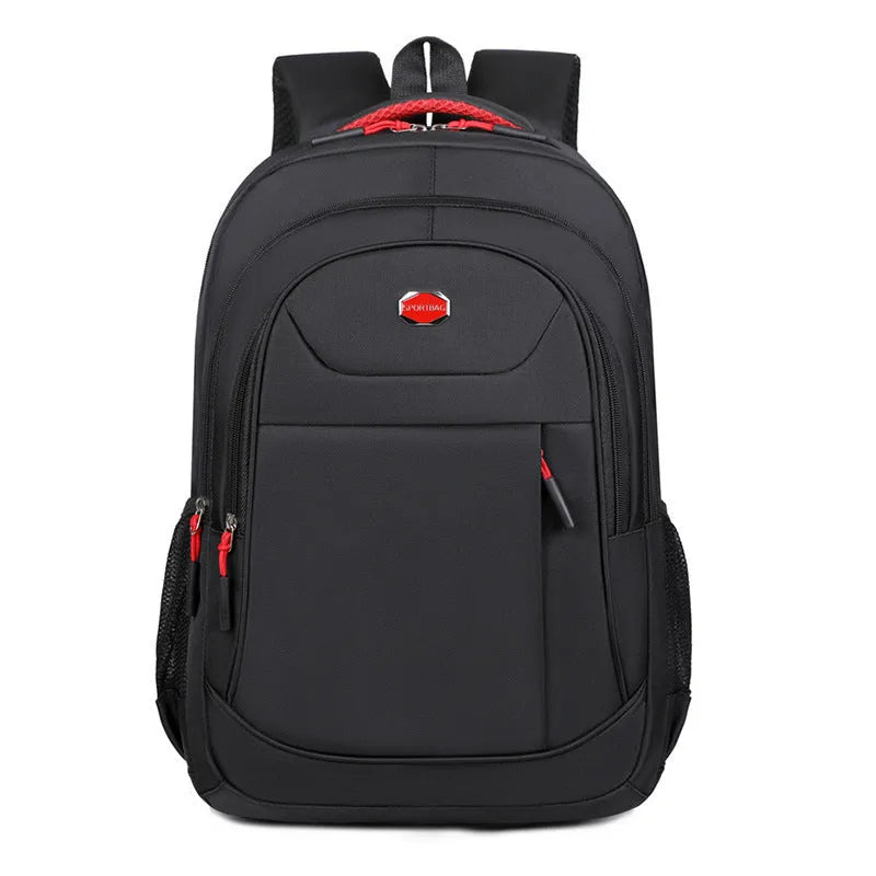 Solid colour Oxford cloth laptop backpack with curved shoulder straps and multi-layer compartments.