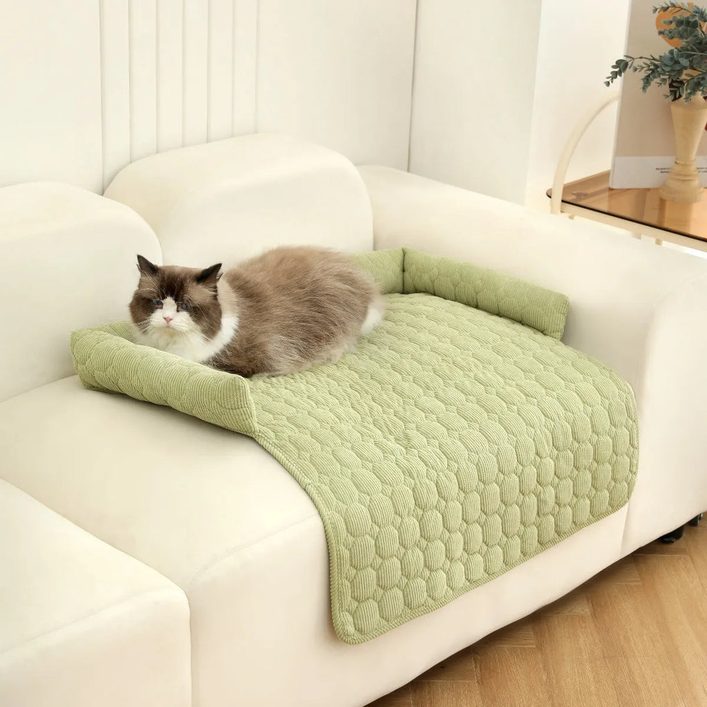 Corduroy pet dog cat bed blanket mat with neck pillow thick soft pad in beige color on a sofa