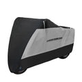 Black polyester motorcycle rain cover with anti-theft features shown fitted on a bike
