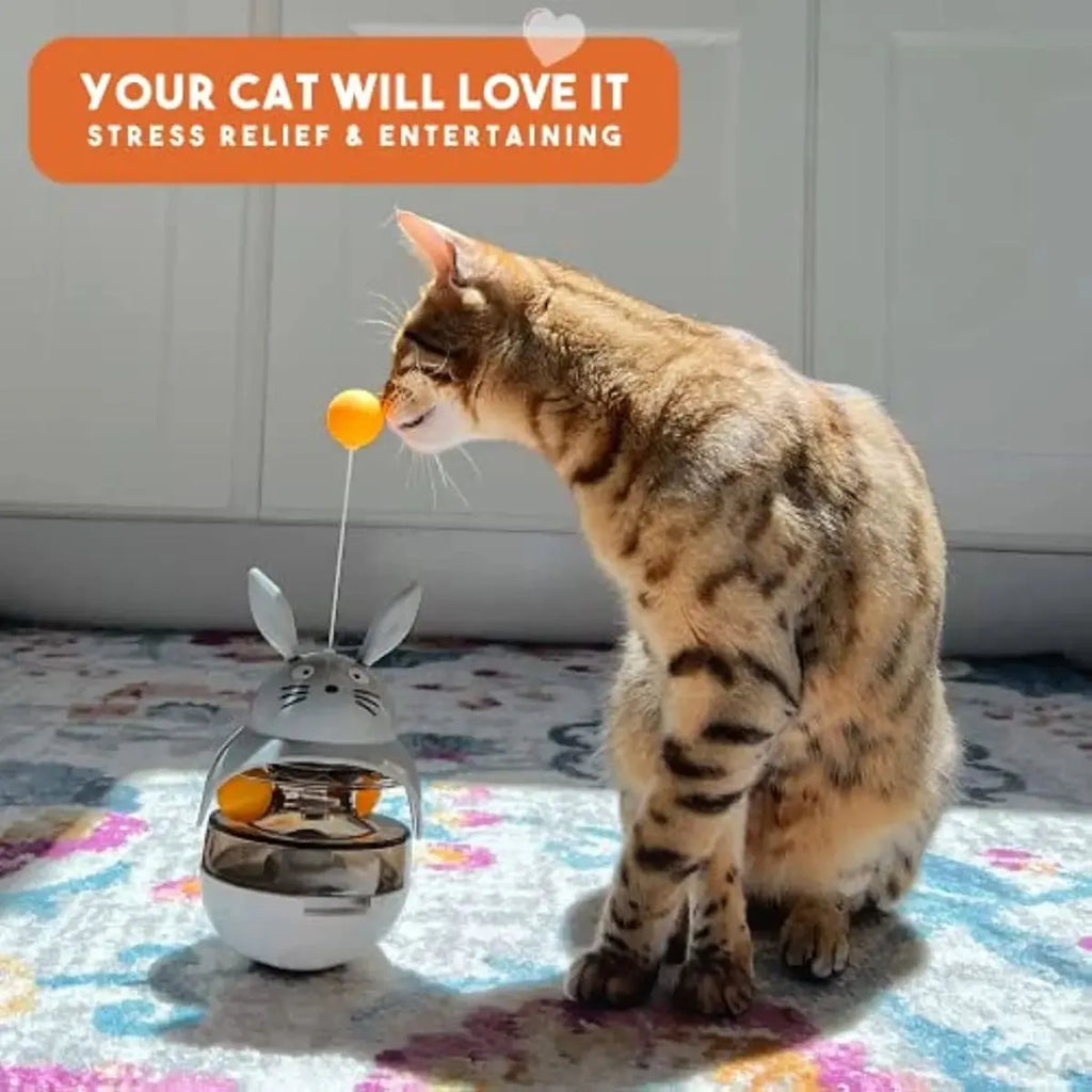 Interactive cat feeder toy treat dispenser with sounding bell in brown colour for indoor cat exercise