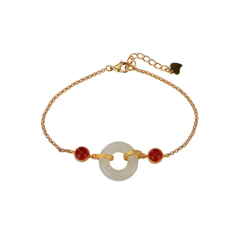Gold-coloured women's bracelet made of S925 sterling silver with a natural Hetian jade peace buckle charm.