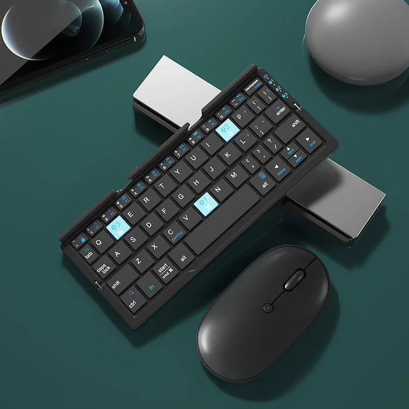 Silver white folding Bluetooth keyboard open with stand holding a smartphone, shown next to its closed compact size.