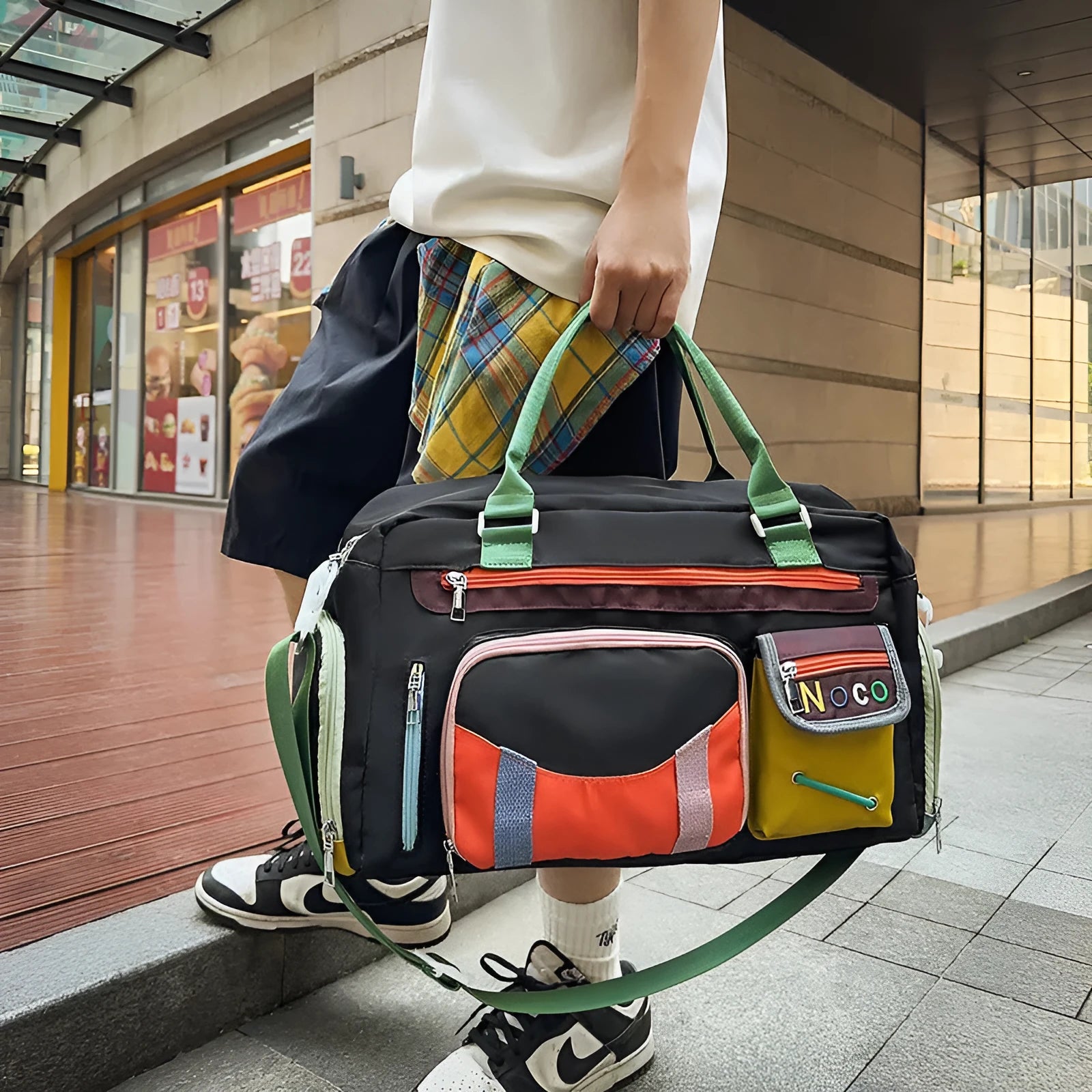 Large capacity sports shoulder messenger bag in black or khaki with 36-55L storage