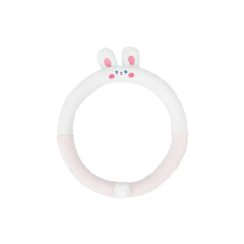 Plush faux fur steering wheel cover with embroidered cartoon bear face, fitted on a car steering wheel