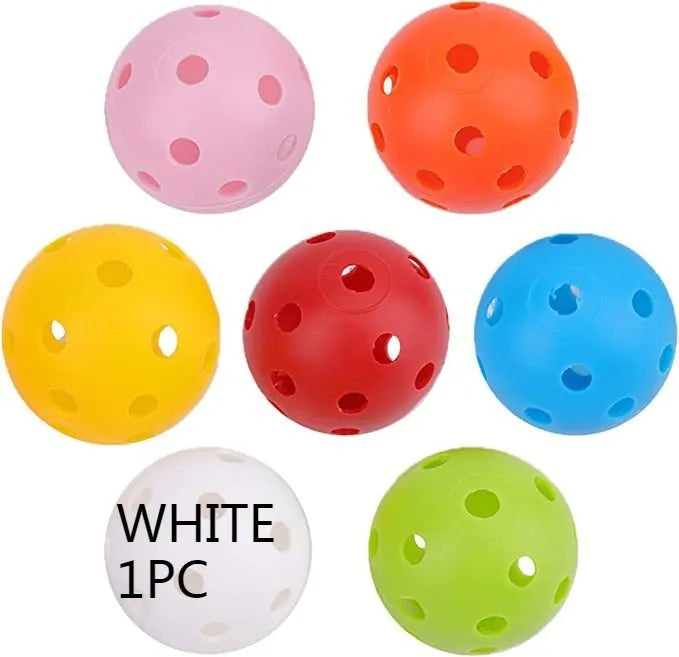 Assorted multi-colour 42mm golf practice balls with a net bag, shown next to practice putting holes.