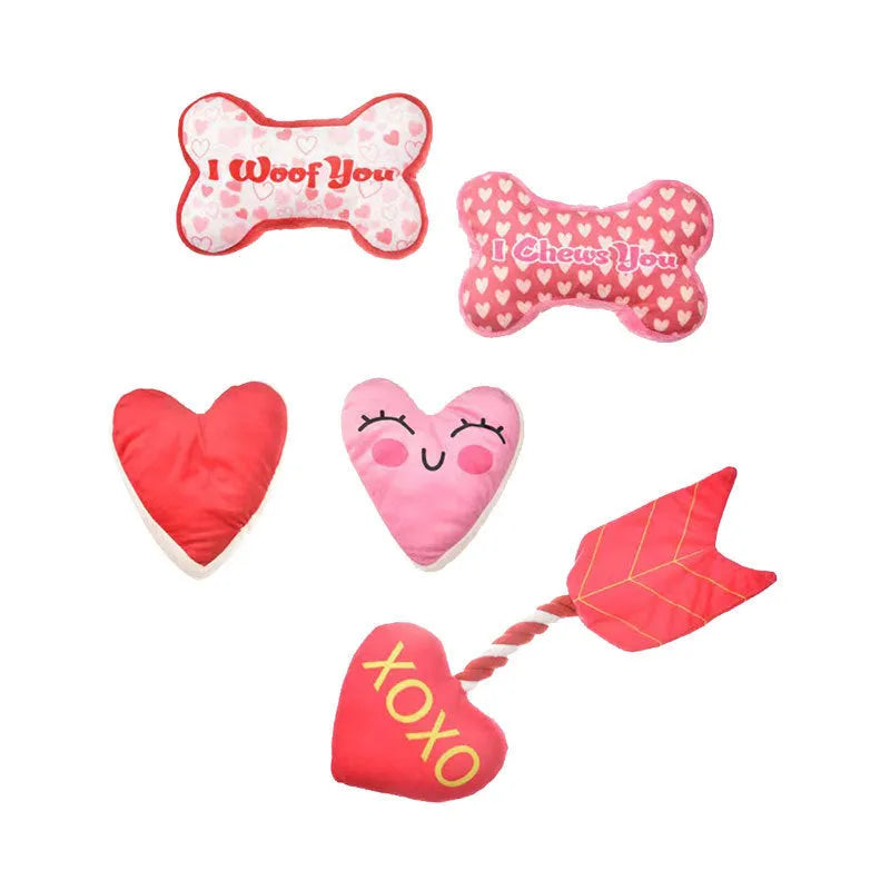 Soft plush dog dental chew toy in peach heart pink colour with textured surface for tooth cleaning.