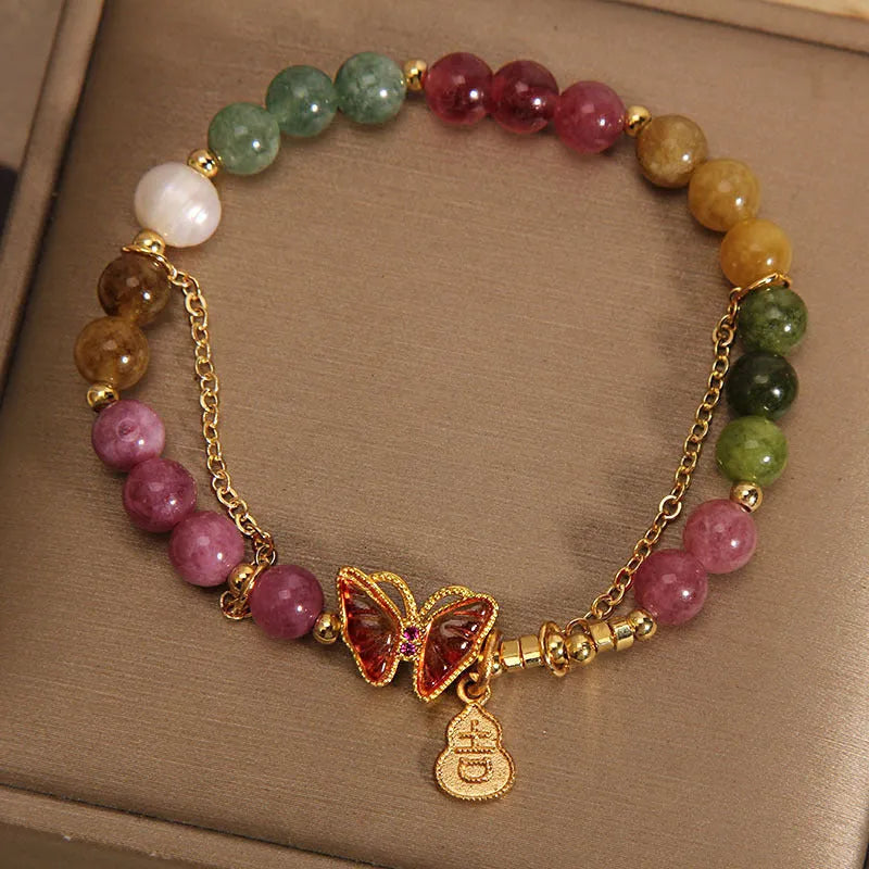 Natural jade coloured agate bracelet with butterfly and gourd pendant.
