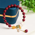 Tian Yu natural cinnabar bracelet with rabbit design in 8mm or 10mm sizes