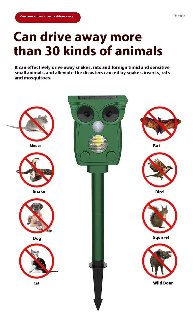 Dark green solar-powered animal repeller with infrared sensor on a garden lawn