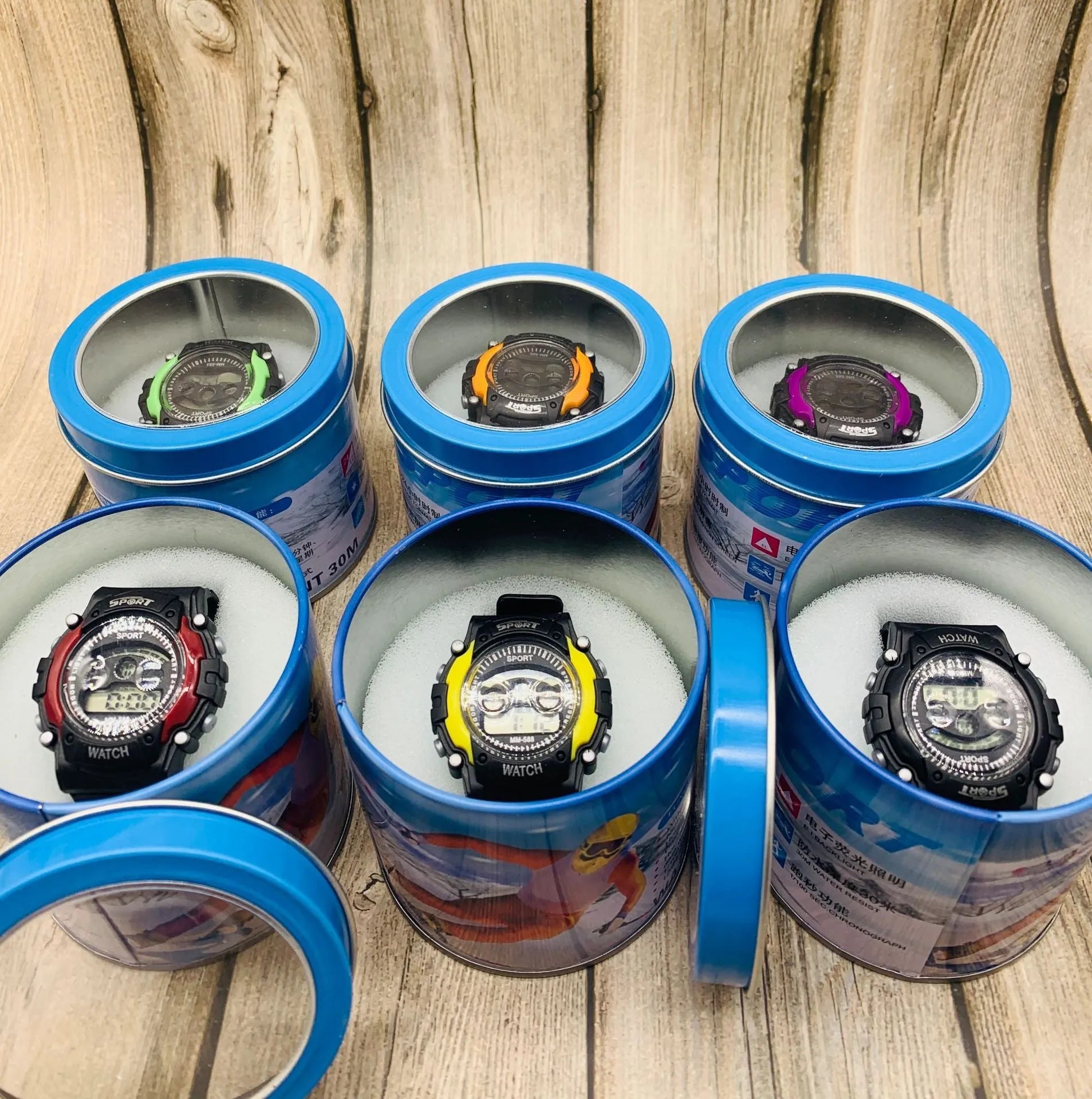 Children's digital sports watch with silicone strap and plastic case, showing digital display.