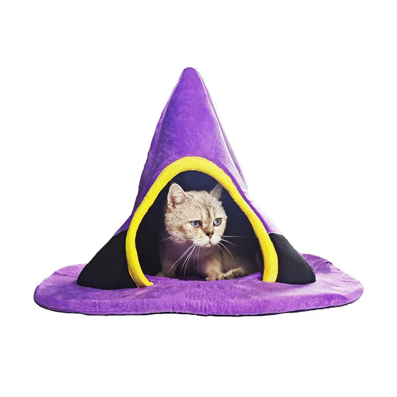 Purple cloth Halloween witch hat shaped cat bed measuring 60 by 45 cm.