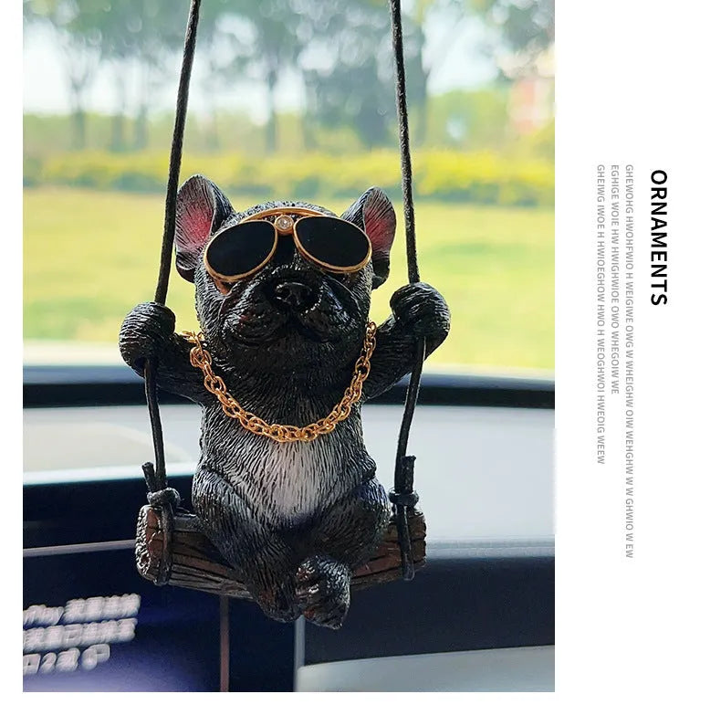 Small resin bulldog cartoon pendant for hanging on a car rearview mirror.