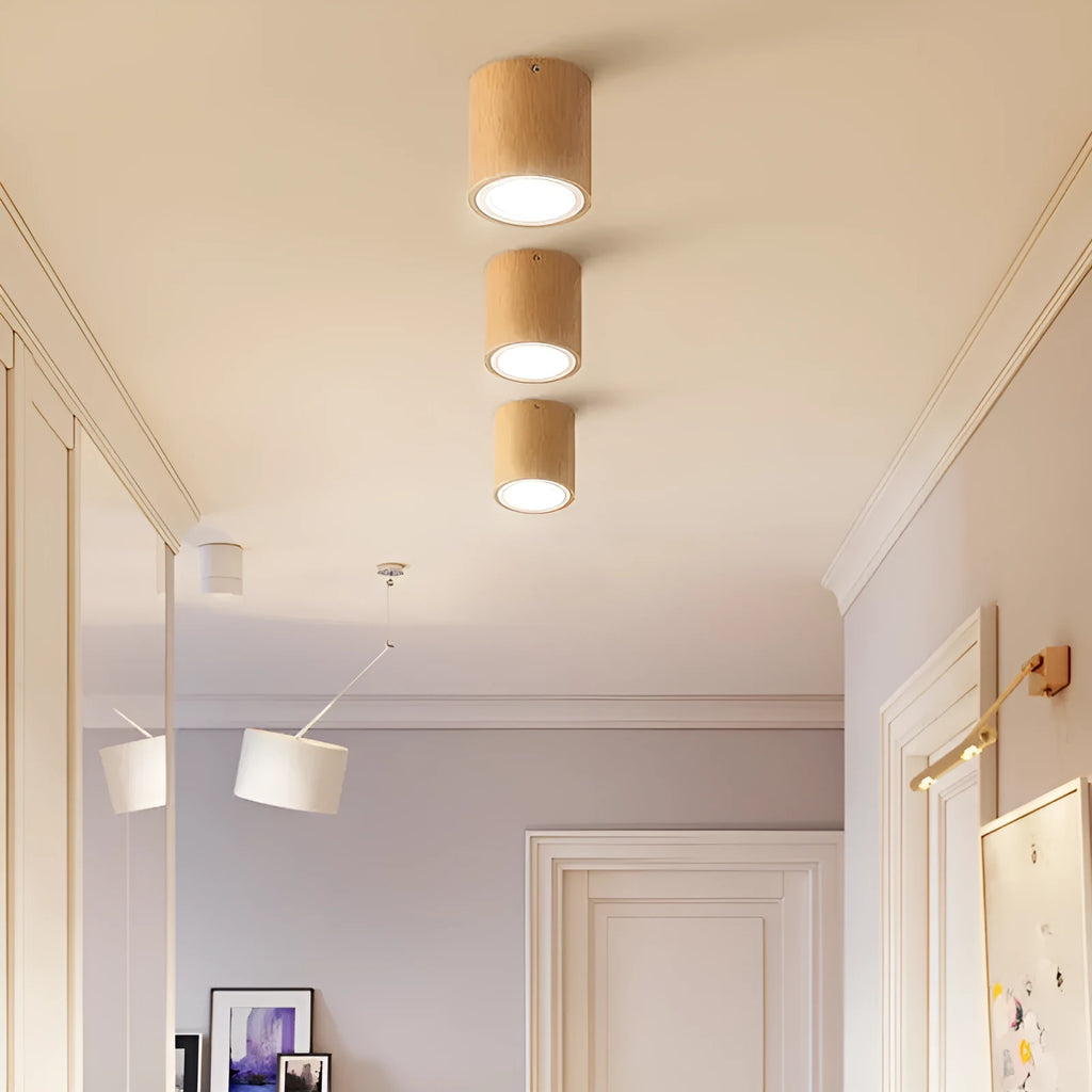 Modern solid wood surface mounted downlight in wood colour, shown in round and square shapes.