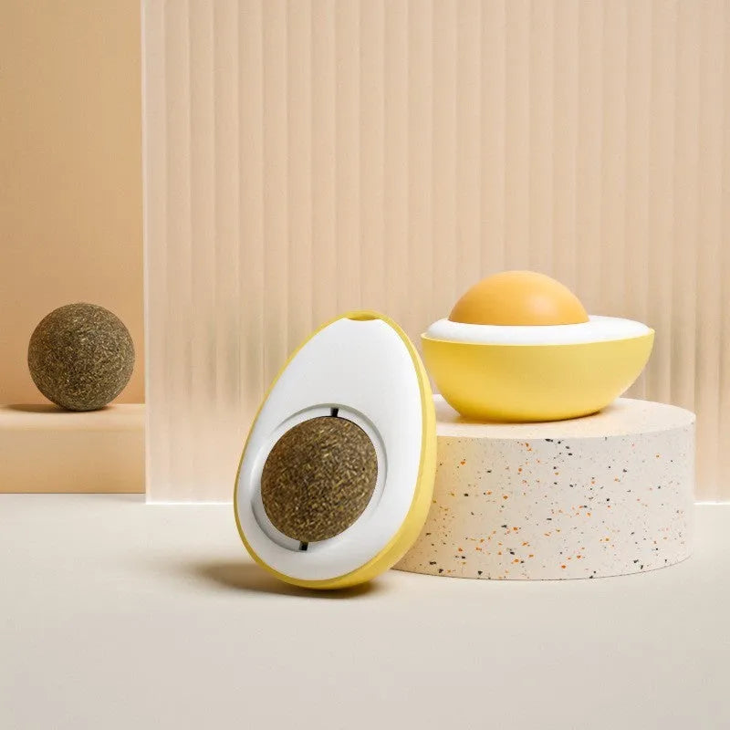 Interactive catnip ball toy with egg design mounted on wall for feline play