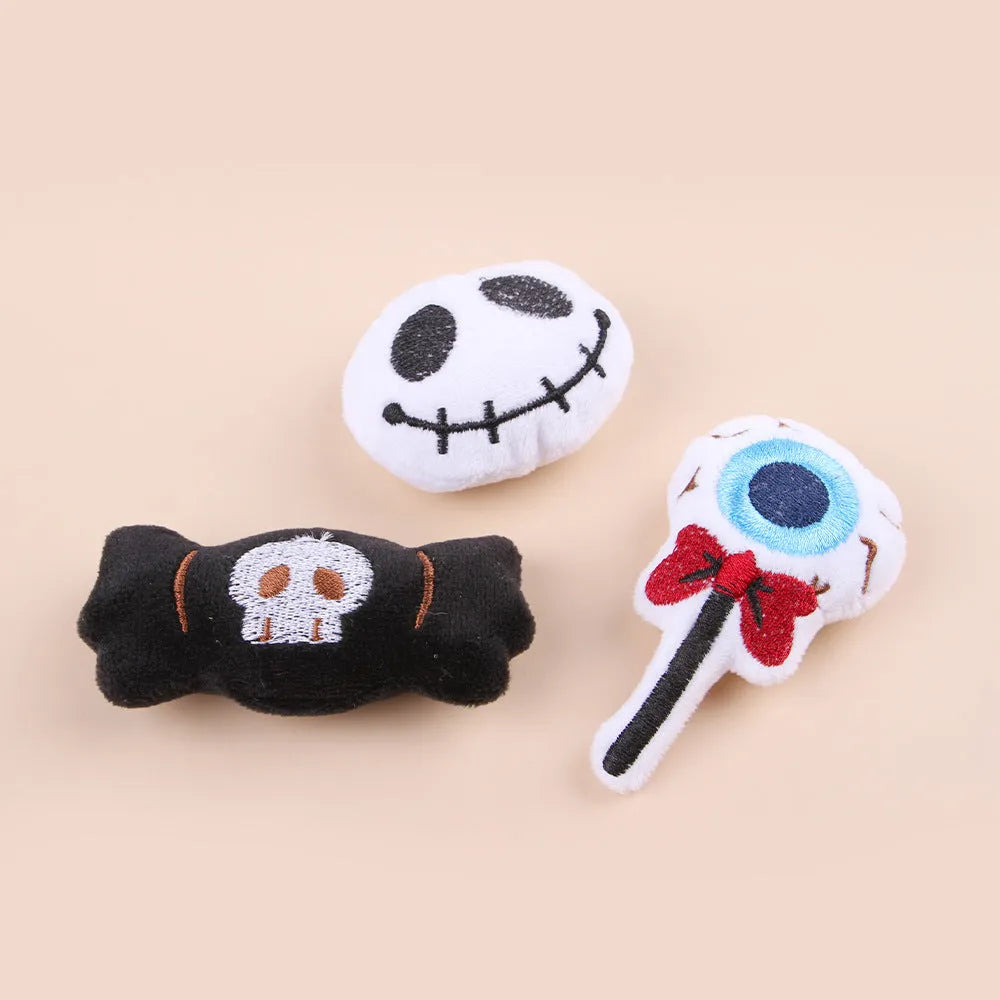 Small plush cat teaser wand toy on a white background, showing eye, candy, and skull design options.
