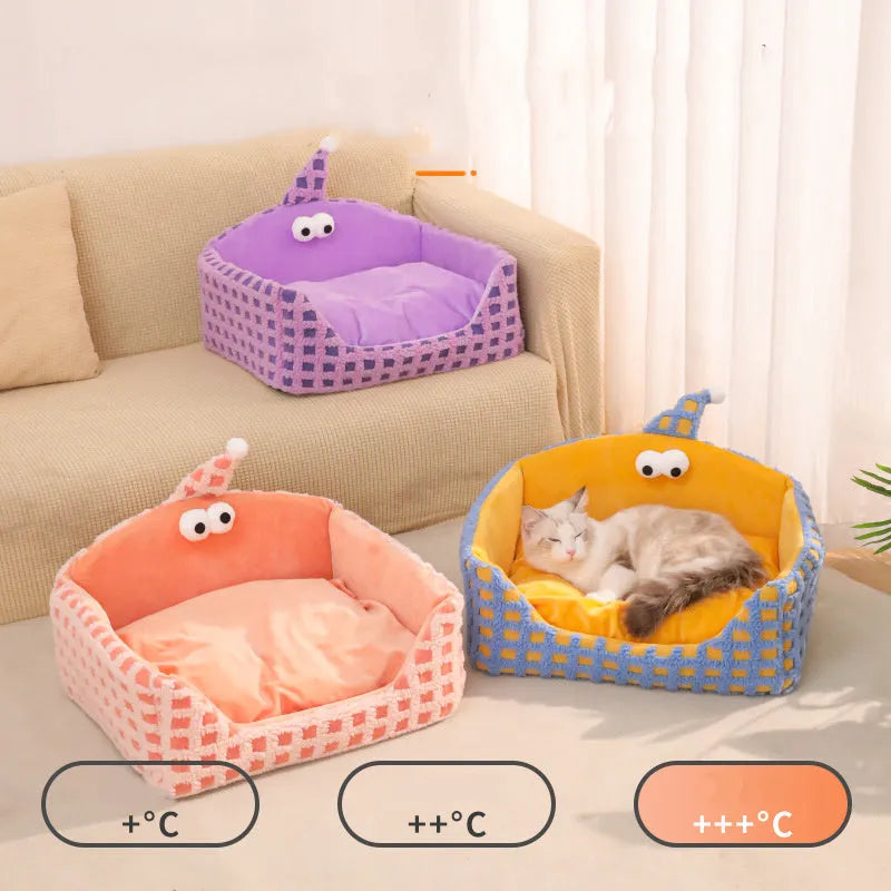 Green triangular pet sleeping nest with removable cover for cats and small dogs.
