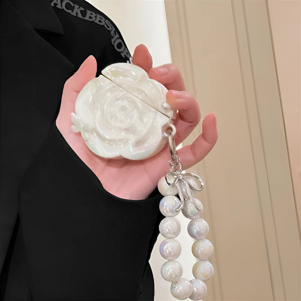 Pearl white camellia silicone AirPods case with lanyard, laser pearlescent finish