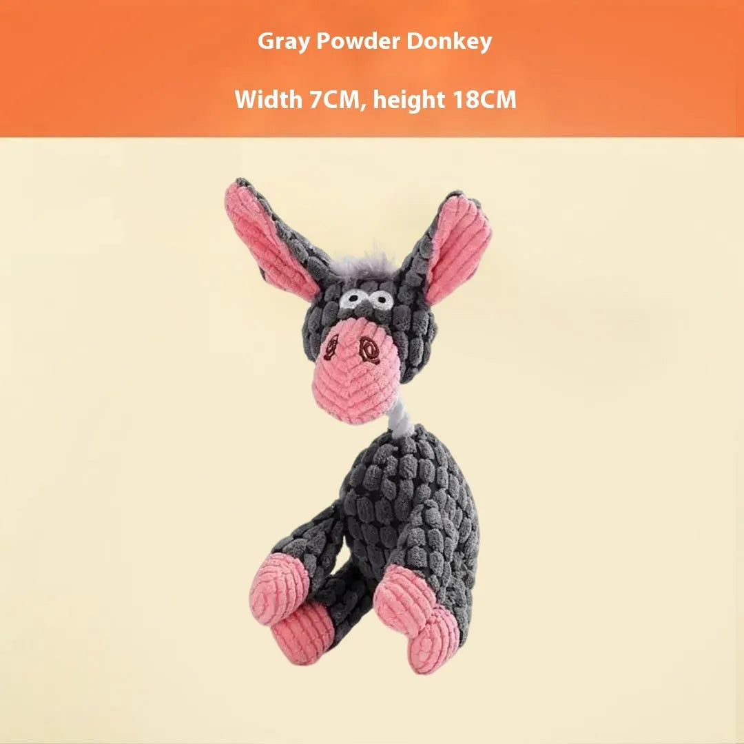 Assorted plush dog toys including a pink-gray donkey, a beige donkey, a blue elephant, and yellow ducks in three sizes.
