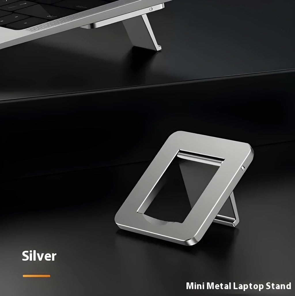 Aluminium folding laptop bracket showing compact size next to laptop with 3M adhesive mounts