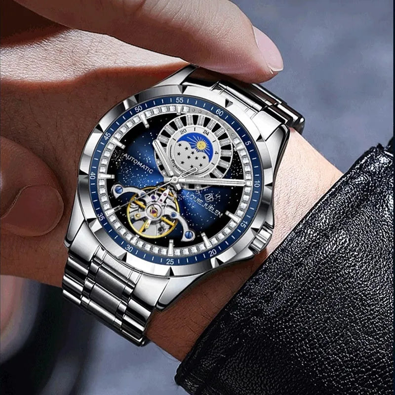 Men's silver and blue automatic waterproof mechanical watch with a stainless steel strap on a wrist