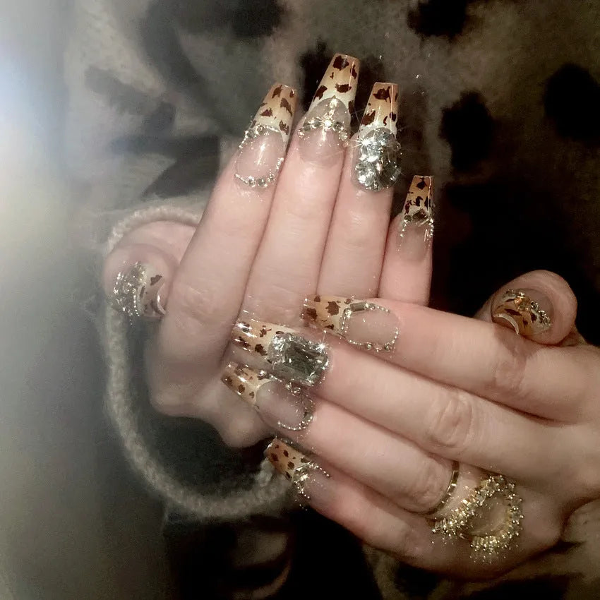 Leopard print wearable nail armor set with advanced flash finish on a white background