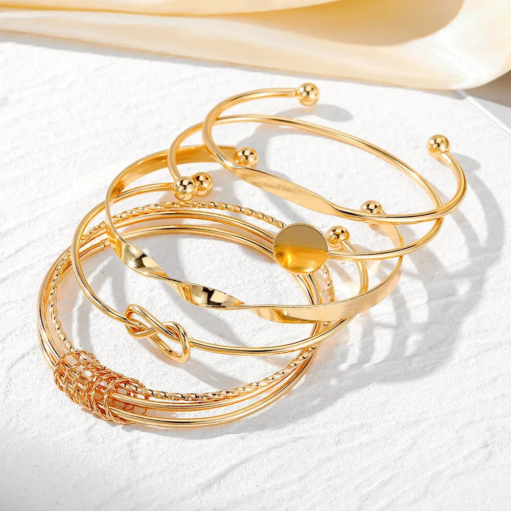 Set of five retro chain bracelets with geometric round, dot, and ring elements in electroplated alloy finish, HS1226 colour.