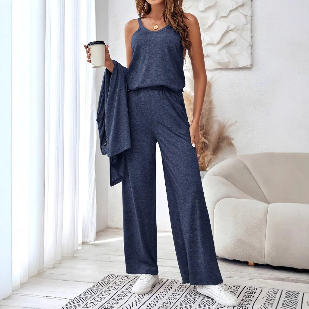 Blue women's three-piece suit with sling top, long cardigan, trousers, and suspenders on a mannequin.