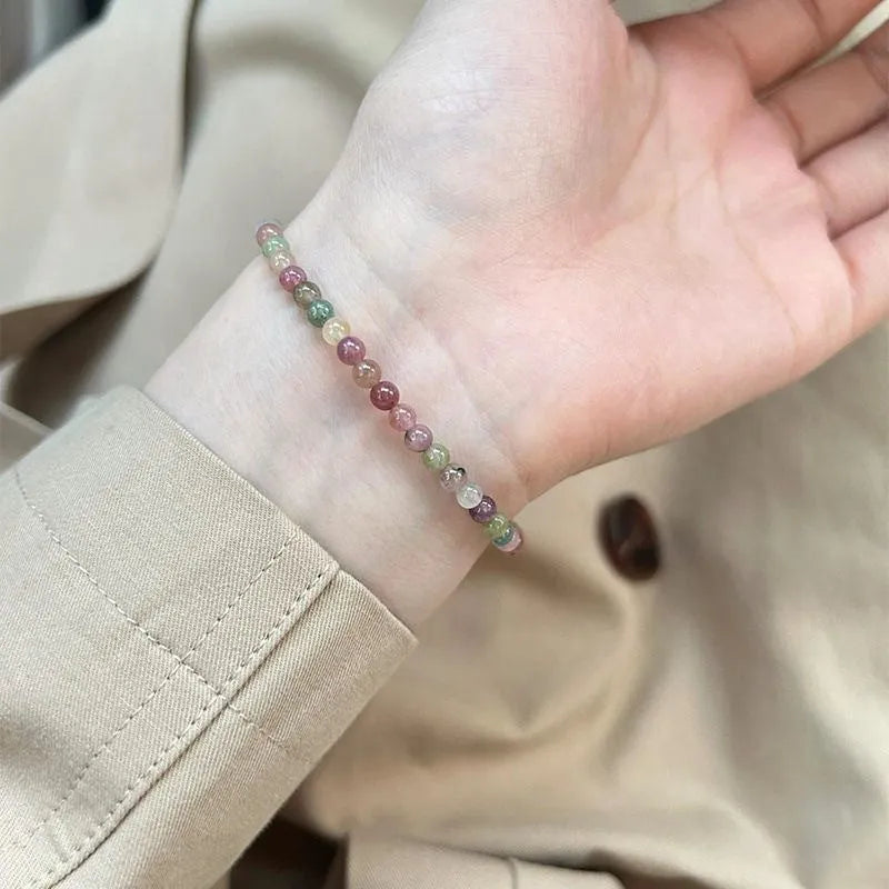 Pink crystal women's bracelet with geometric shape and electroplated finish in colour option selection.