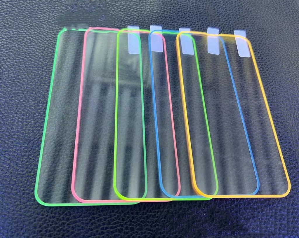 Fluorescent pink tempered glass screen protector fitted on an iPhone 13, showing full-screen coverage and luminous glow.