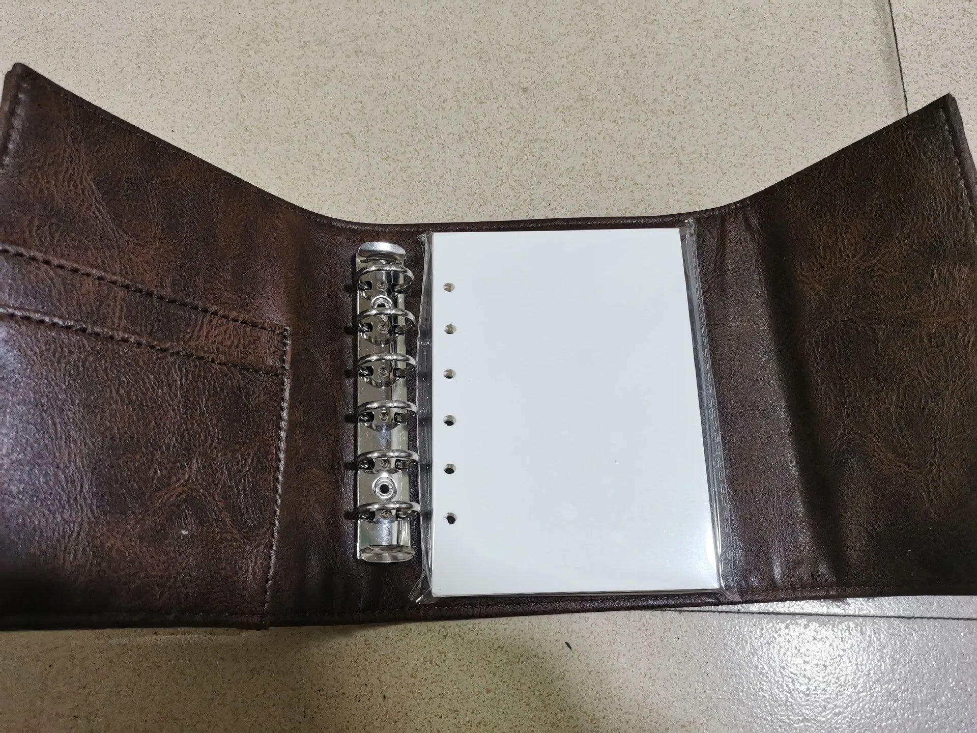 Brown retro leather buckle notebook in A7 size with PU cover and loose-leaf binding
