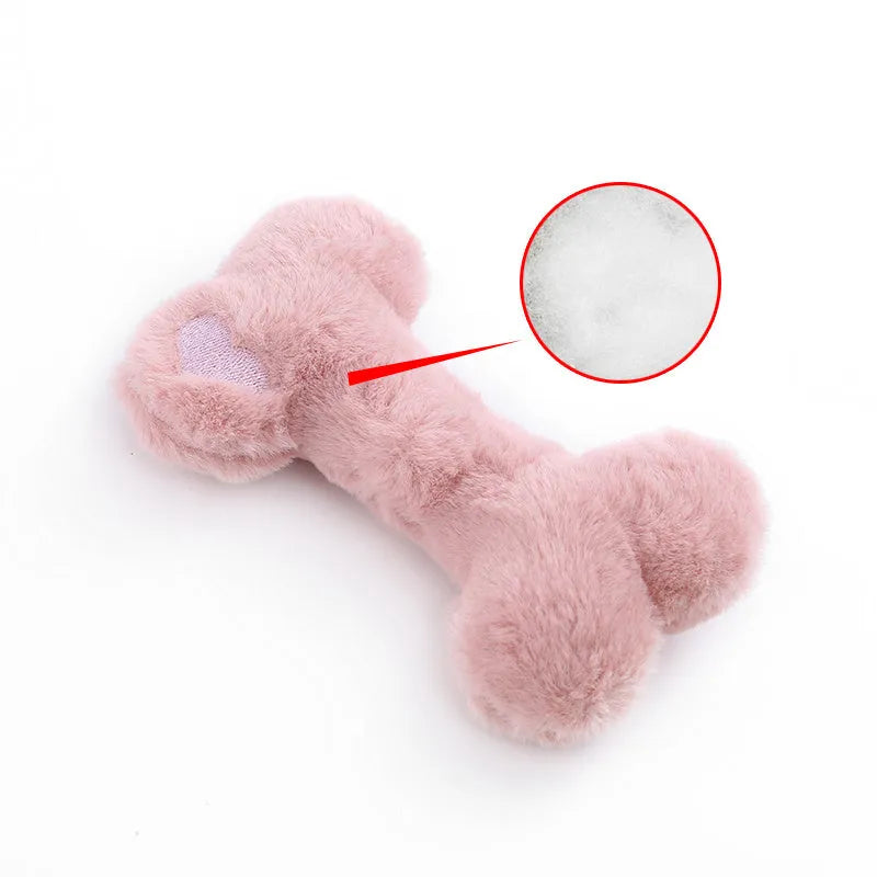 Blue love bone shaped plush dog toy with a squeaker, on a neutral background