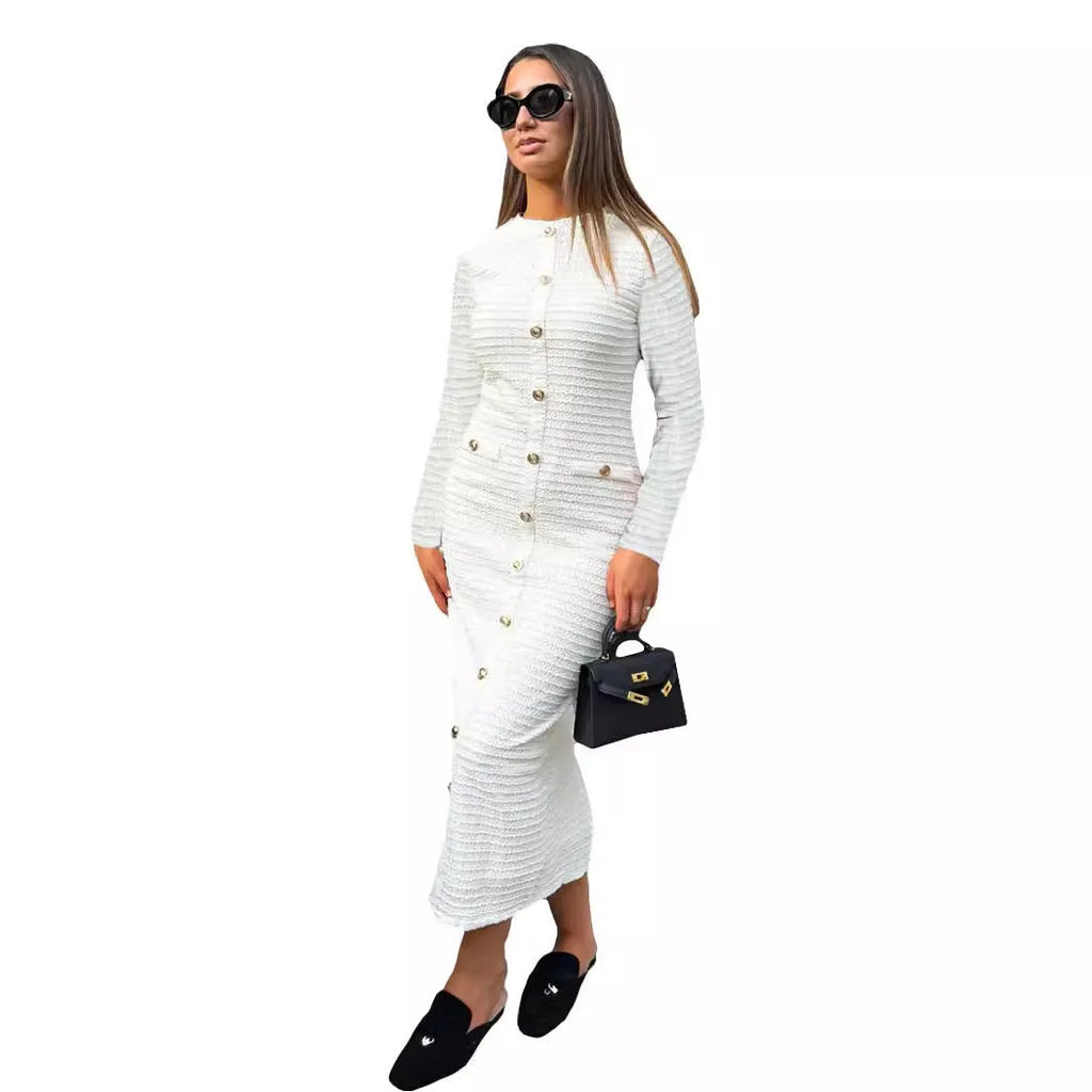 Black retro slim fit knitted long-sleeved dress with buttons on a hanger.