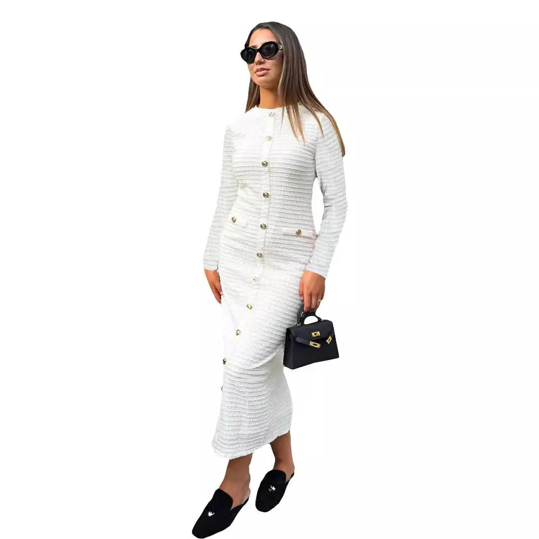 Black retro slim fit knitted long-sleeved dress with buttons on a hanger.