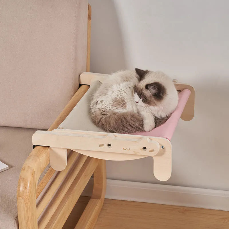 Solid wood cat bed with removable cushion in grey-toned seasonal pattern colours