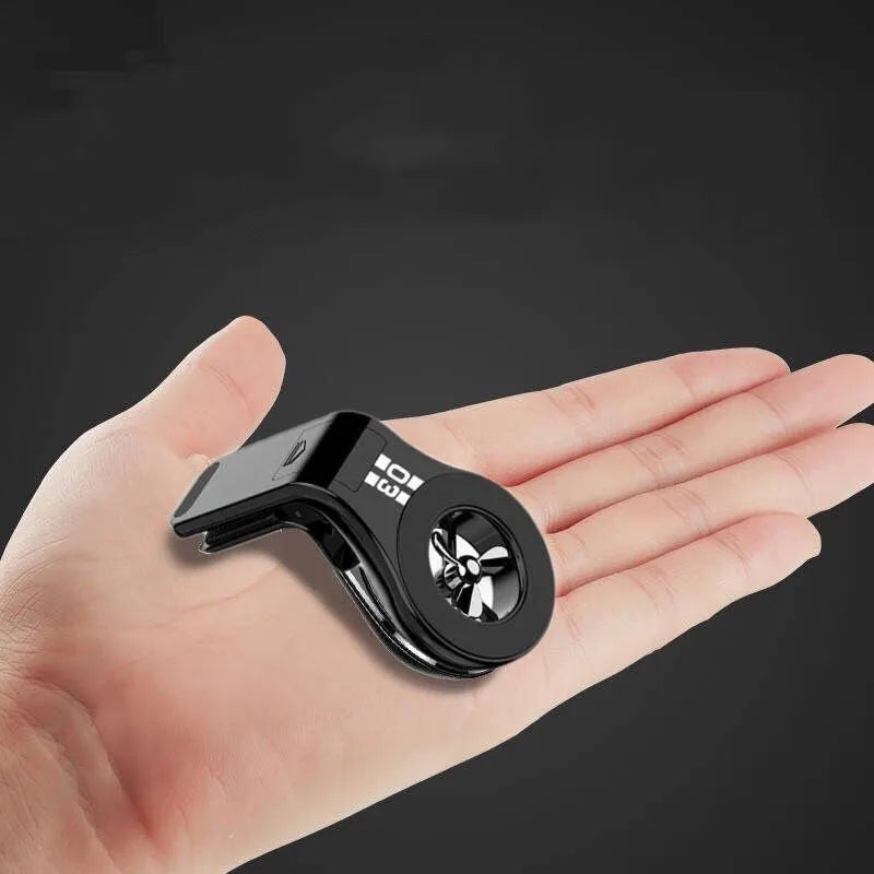 Magnetic car phone holder mounted on vehicle air vent with smartphone attached